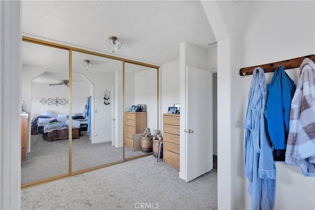 15761 Joshua Rd, Apple Valley, CA 92307 - carpeted bedroom featuring a closet and a textured ceiling
