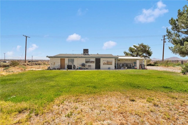 15761 Joshua Rd, Apple Valley, CA 92307 - rear view of house with a yard and a patio area