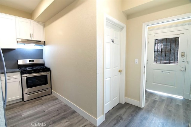 1703 Toberman St, Los Angeles, CA 90015 - kitchen featuring gas stove, under cabinet range hood, wood finished floors, and white cabinets