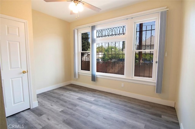 1703 Toberman St, Los Angeles, CA 90015 - empty room with a ceiling fan and wood finished floors