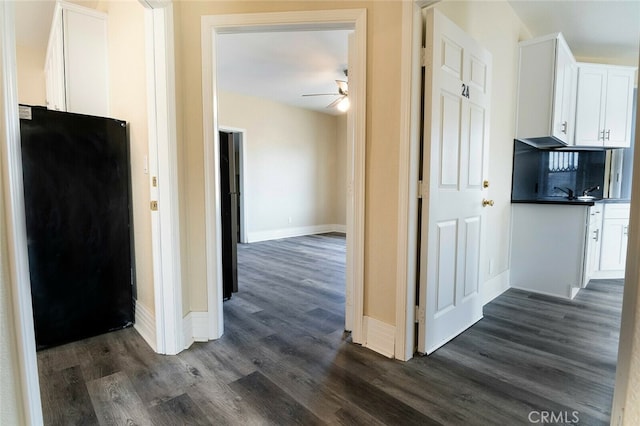 1703 Toberman St, Los Angeles, CA 90015 - hallway featuring dark wood-style floors and baseboards