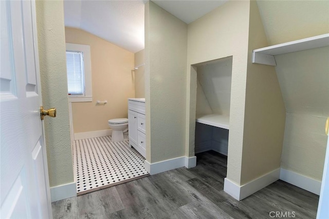 1703 Toberman St, Los Angeles, CA 90015 - bathroom featuring vanity, lofted ceiling, and wood finished floors