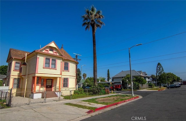 1703 Toberman St, Los Angeles, CA 90015 - victorian-style house with covered porch, a fenced front yard, and a gate
