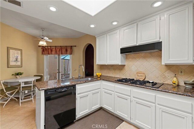 71 Via Barcaza, Coto De Caza, CA 92679 - kitchen with dishwasher, gas cooktop, arched walkways, white cabinetry, and a peninsula