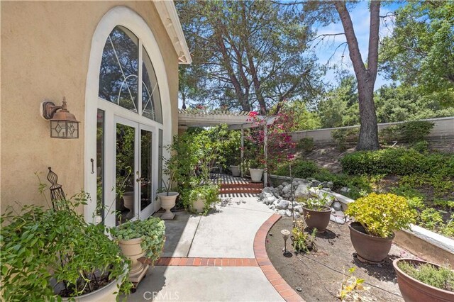 71 Via Barcaza, Coto De Caza, CA 92679 - fenced backyard featuring a patio, french doors, and a pergola