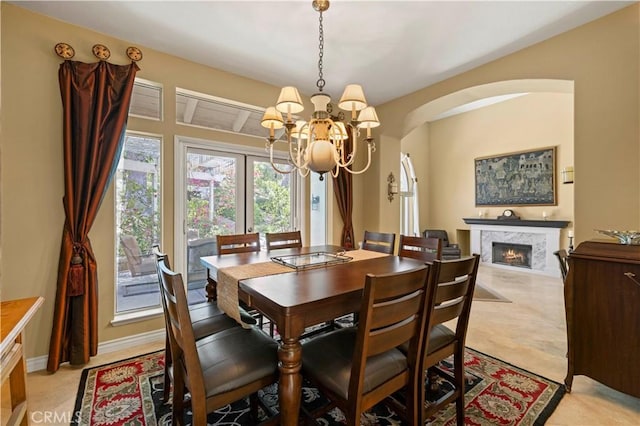 71 Via Barcaza, Coto De Caza, CA 92679 - dining room featuring a chandelier, a tile fireplace, and arched walkways