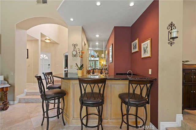 71 Via Barcaza, Coto De Caza, CA 92679 - bar area with arched walkways, recessed lighting, and light tile patterned floors