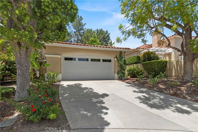 71 Via Barcaza, Coto De Caza, CA 92679 - mediterranean / spanish house with concrete driveway, stucco siding, a garage, and a tile roof