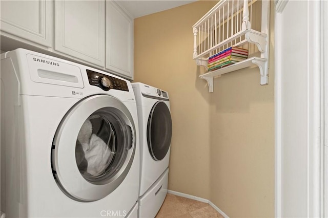 71 Via Barcaza, Coto De Caza, CA 92679 - laundry area featuring washer and clothes dryer, cabinet space, and light tile patterned flooring