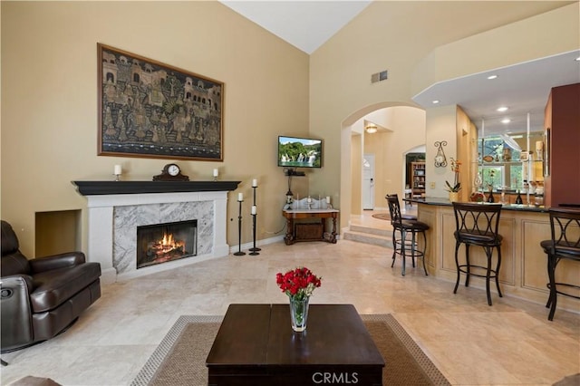 71 Via Barcaza, Coto De Caza, CA 92679 - living area with arched walkways, a high end fireplace, and high vaulted ceiling