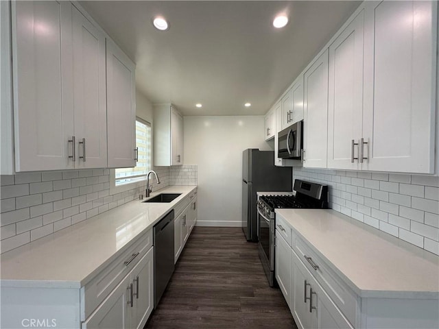 1942 S Sherbourne Dr, Los Angeles, CA 90034 - kitchen featuring stainless steel appliances, dark wood-style flooring, light countertops, recessed lighting, and decorative backsplash