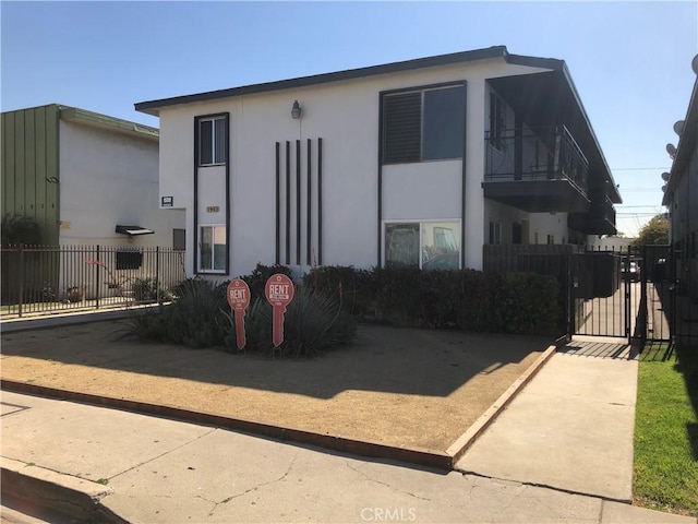 1942 S Sherbourne Dr, Los Angeles, CA 90034 - view of front of property with stucco siding and a gate