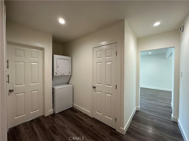 1942 S Sherbourne Dr, Los Angeles, CA 90034 - laundry area with estacked washer and dryer, dark wood finished floors, and recessed lighting
