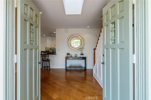 8042 Driftwood Dr, Huntington Beach, CA 92646 - entryway featuring wood finished floors, stairs, and recessed lighting