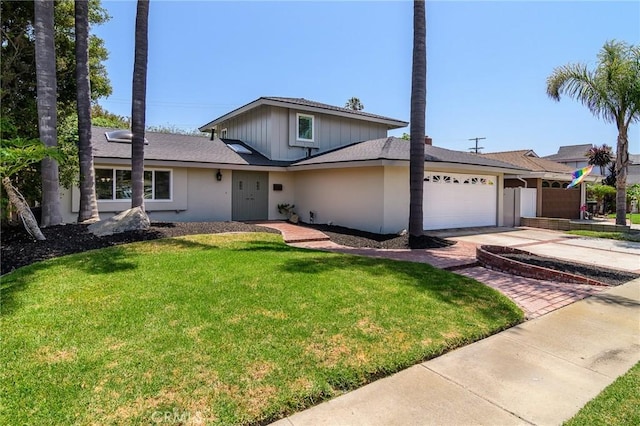 8042 Driftwood Dr, Huntington Beach, CA 92646 - traditional home featuring driveway, a garage, a front yard, stucco siding, and board and batten siding
