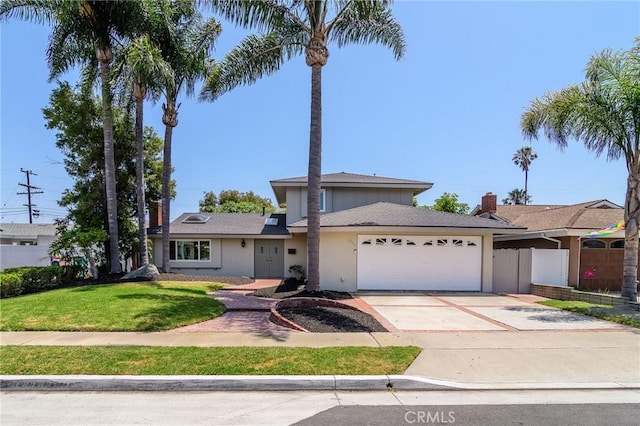 8042 Driftwood Dr, Huntington Beach, CA 92646 - traditional-style house with a garage, concrete driveway, and a chimney