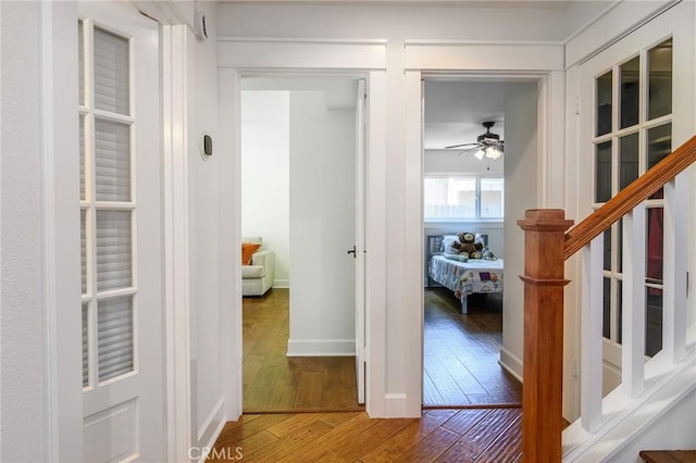 8042 Driftwood Dr, Huntington Beach, CA 92646 - hall with hardwood / wood-style flooring and stairway