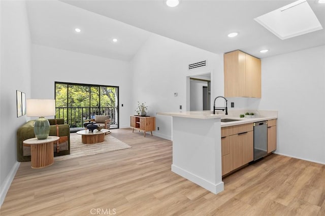 4210 Via Arbolada Unit 317, Los Angeles, CA 90042 - kitchen featuring dishwasher, light brown cabinets, a skylight, open floor plan, and recessed lighting