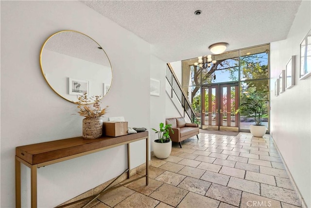 4210 Via Arbolada Unit 317, Los Angeles, CA 90042 - foyer with a chandelier and a textured ceiling