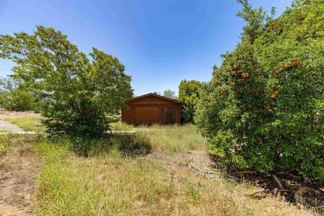 29556 Sierra Rojo Ln, Valley Center, CA 92082 - view of yard featuring a garage and an outbuilding
