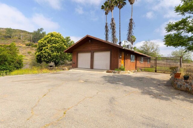 29556 Sierra Rojo Ln, Valley Center, CA 92082 - view of front of property featuring a garage