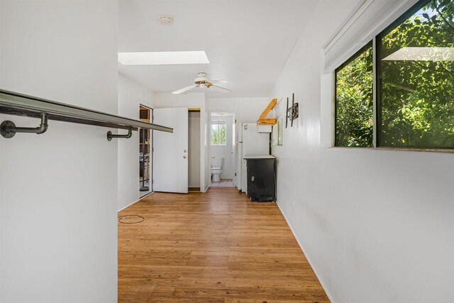 29556 Sierra Rojo Ln, Valley Center, CA 92082 - corridor featuring a skylight and wood finished floors