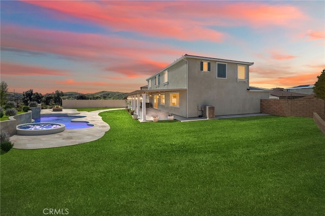 11638 Zoeller St, Beaumont, CA 92223 - back of property with a fenced backyard, a patio area, and stucco siding