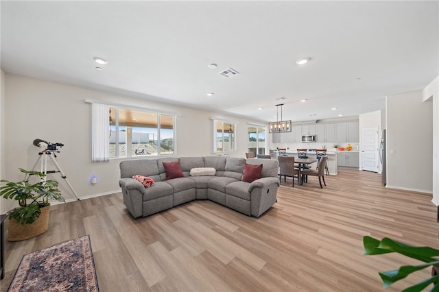 11638 Zoeller St, Beaumont, CA 92223 - living room with light wood-style floors and recessed lighting