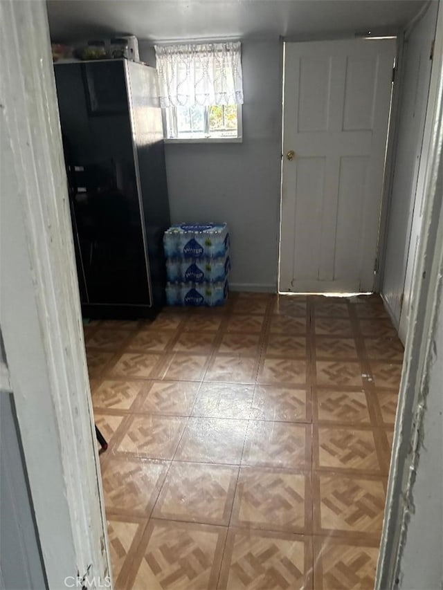 12201222 E 49th St, Los Angeles, CA 90011 - unfurnished bedroom featuring freestanding refrigerator