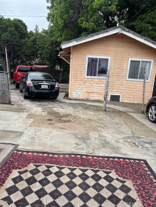 12201222 E 49th St, Los Angeles, CA 90011 - view of home's exterior featuring driveway