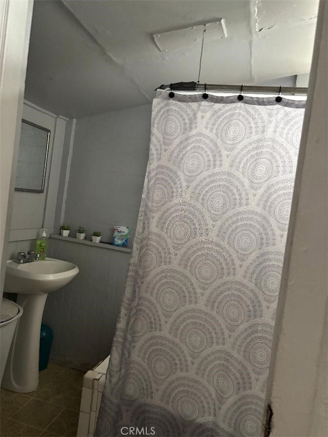 12201222 E 49th St, Los Angeles, CA 90011 - bathroom featuring tile patterned flooring, curtained shower, and baseboard heating