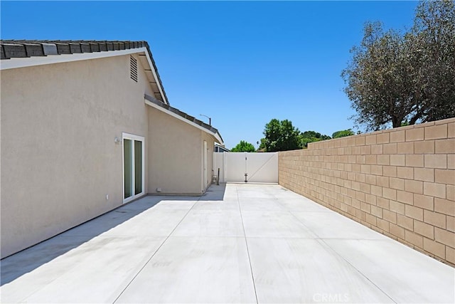 4004 Polk Ct, Chino, CA 91710 - fenced backyard with a gate and a patio