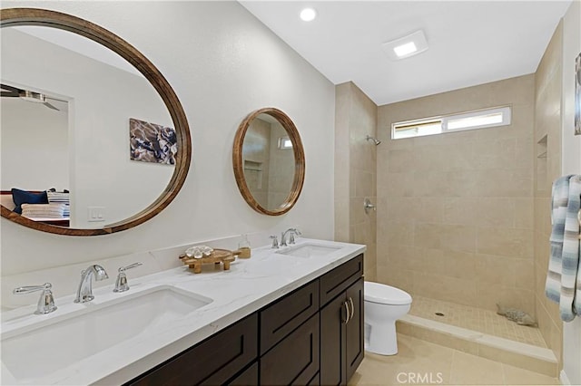 4004 Polk Ct, Chino, CA 91710 - bathroom with double vanity, tiled shower, tile patterned floors, and recessed lighting