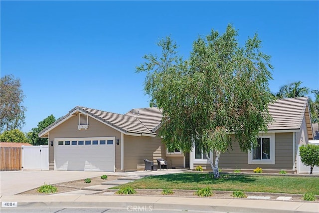 4004 Polk Ct, Chino, CA 91710 - view of front of property featuring a tiled roof, a garage, and concrete driveway