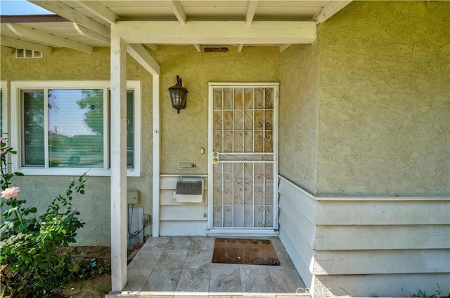 405 W Virginia Ave, Glendora, CA 91741 - doorway to property featuring stucco siding