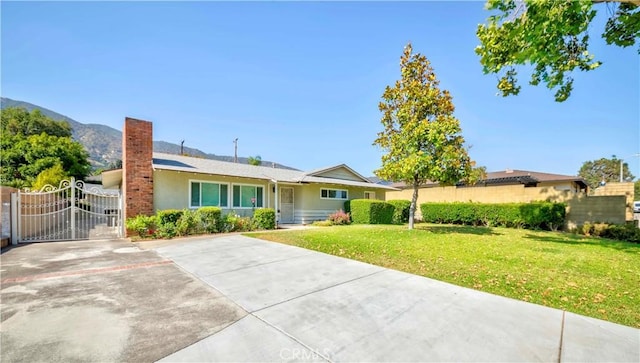 405 W Virginia Ave, Glendora, CA 91741 - ranch-style home with a gate, stucco siding, a chimney, and a mountain view