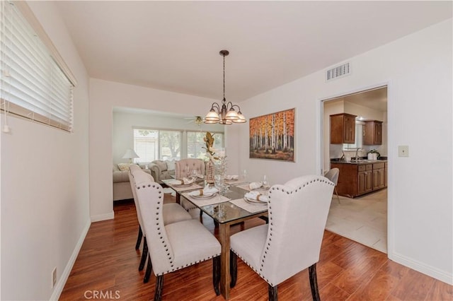 405 W Virginia Ave, Glendora, CA 91741 - dining area featuring a chandelier and light wood finished floors