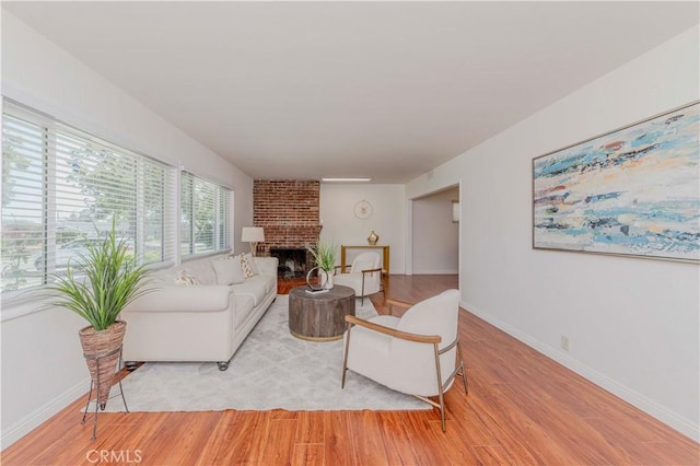 405 W Virginia Ave, Glendora, CA 91741 - living room featuring light wood finished floors and a fireplace