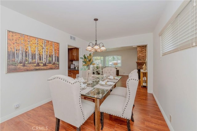405 W Virginia Ave, Glendora, CA 91741 - dining room with a chandelier and light wood-style floors
