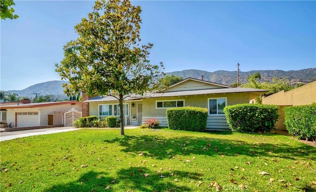 405 W Virginia Ave, Glendora, CA 91741 - ranch-style house featuring a mountain view, an attached garage, stucco siding, and driveway
