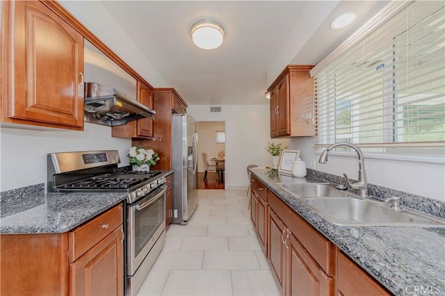 405 W Virginia Ave, Glendora, CA 91741 - kitchen with stainless steel appliances, brown cabinetry, light tile patterned floors, and ventilation hood