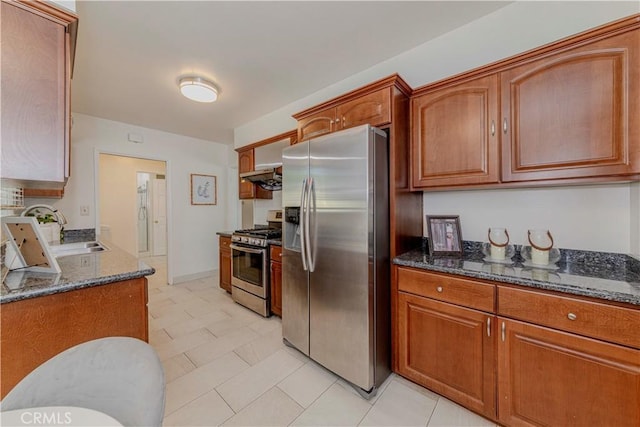 405 W Virginia Ave, Glendora, CA 91741 - kitchen featuring appliances with stainless steel finishes, dark stone countertops, and brown cabinets