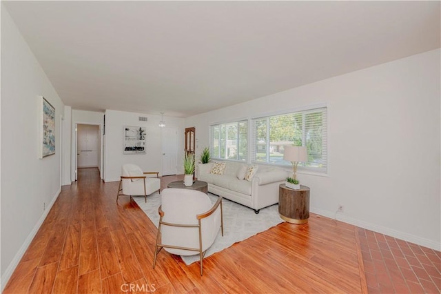 405 W Virginia Ave, Glendora, CA 91741 - living area with baseboards and light wood-style floors