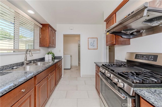 405 W Virginia Ave, Glendora, CA 91741 - kitchen with stainless steel gas range, premium range hood, brown cabinetry, and dark stone countertops