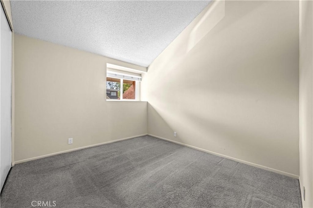 6741 Caro St, Paramount, CA 90723 - unfurnished room with a textured ceiling, carpet, and lofted ceiling