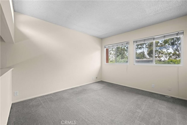 6741 Caro St, Paramount, CA 90723 - empty room with a textured ceiling and carpet floors