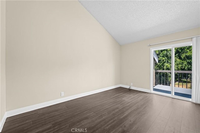 6741 Caro St, Paramount, CA 90723 - empty room with dark wood-type flooring, vaulted ceiling, and a textured ceiling