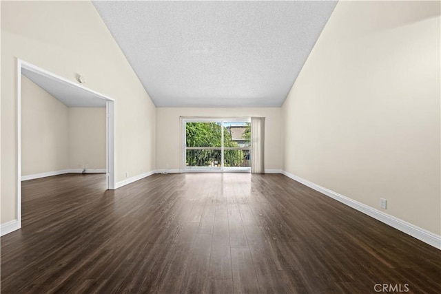 6741 Caro St, Paramount, CA 90723 - unfurnished living room featuring lofted ceiling, dark wood-type flooring, and a textured ceiling