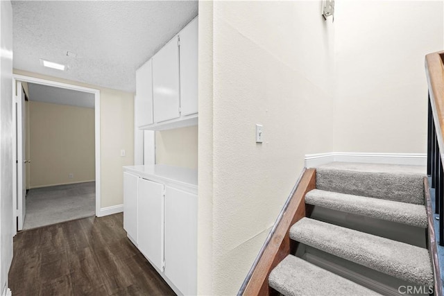 6741 Caro St, Paramount, CA 90723 - staircase featuring wood finished floors and a textured ceiling