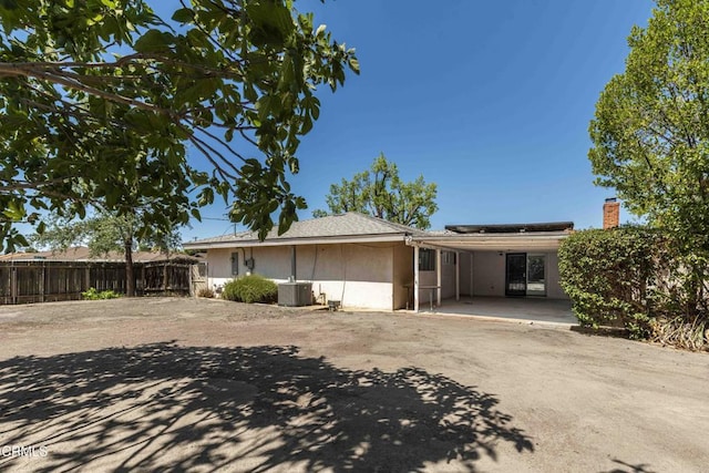 6000 Eugene Pl, Bakersfield, CA 93308 - view of front of house with roof mounted solar panels and a patio area